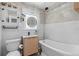 Bathroom featuring modern fixtures, decorative tile, and a shower/tub combo at 701 14Th N St, St Petersburg, FL 33705