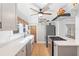 Modern kitchen features white countertops, stainless steel appliances, and hardwood floors at 701 14Th N St, St Petersburg, FL 33705