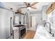 Well-equipped kitchen with stainless steel appliances, quartz countertops and hardwood floors at 701 14Th N St, St Petersburg, FL 33705