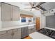 Updated kitchen featuring white quartz counters, subway tile backsplash and stainless steel appliances at 701 14Th N St, St Petersburg, FL 33705