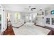 Spacious living room with hardwood floors, a large rug, a fireplace, and lots of natural light at 701 14Th N St, St Petersburg, FL 33705