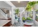 View of the sunroom featuring patterned tile flooring, views of the outside, and entry to the house at 701 14Th N St, St Petersburg, FL 33705