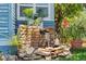 Delightful outdoor water feature surrounded by lush greenery and tropical plants at 701 14Th N St, St Petersburg, FL 33705
