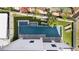 Aerial shot of a backyard pool, with a spa and well-manicured yard space at 706 S Davis Blvd, Tampa, FL 33606