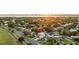 Aerial view of property highlighting the home's curb appeal and lush landscaping with the bay in the background at 706 S Davis Blvd, Tampa, FL 33606