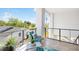 Balcony featuring outdoor seating, tile flooring and views of the surrounding neighborhood at 706 S Davis Blvd, Tampa, FL 33606