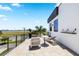 Modern rooftop terrace with seating, offering expansive views of the city and airport in the distance at 706 S Davis Blvd, Tampa, FL 33606
