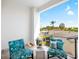 Cozy balcony with tile flooring and comfortable chairs, perfect for enjoying the outdoor views at 706 S Davis Blvd, Tampa, FL 33606