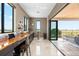 Stylish entertainment area with counter seating that opens onto a covered outdoor terrace with a great view at 706 S Davis Blvd, Tampa, FL 33606