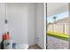 Compact bathroom with toilet and corner sink, located off the patio with artificial turf, convenient for outdoor use at 706 S Davis Blvd, Tampa, FL 33606