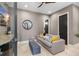 Comfortable bonus room features a couch, ottoman and a flat-screen TV at 706 S Davis Blvd, Tampa, FL 33606