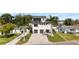 Two story home with manicured lawn, a brick driveway, and two car garage at 706 S Davis Blvd, Tampa, FL 33606