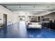 Garage space with epoxy floors and storage for cars and equipment at 706 S Davis Blvd, Tampa, FL 33606