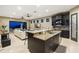 Modern kitchen with a large island, granite countertops, dark wood cabinetry, and open view to the living area at 706 S Davis Blvd, Tampa, FL 33606