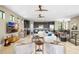 Spacious living room featuring tile floors, stylish decor, and an open layout to the kitchen at 706 S Davis Blvd, Tampa, FL 33606