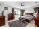 Spacious main bedroom with a ceiling fan and a view of the outdoor landscape at 706 S Davis Blvd, Tampa, FL 33606
