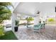 Covered patio featuring outdoor furniture, plants, and a view of the pool and backyard at 706 S Davis Blvd, Tampa, FL 33606