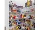 Walk-in pantry with wire shelving filled with food items and household supplies at 706 S Davis Blvd, Tampa, FL 33606