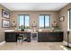 Entertainers wet bar featuring custom cabinetry, a beverage fridge, and a unique countertop at 706 S Davis Blvd, Tampa, FL 33606