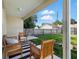 Relaxing porch area featuring a black and white rug and nice seating area at 718 30Th N Ave, St Petersburg, FL 33704