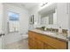 Updated bathroom with granite counters, wood cabinets and tile flooring at 718 30Th N Ave, St Petersburg, FL 33704