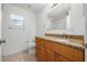 Bathroom featuring a granite countertop vanity with ample storage at 718 30Th N Ave, St Petersburg, FL 33704