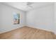 This bedroom features wood floors and windows offering natural light at 718 30Th N Ave, St Petersburg, FL 33704