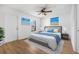 Stylishly furnished bedroom featuring a queen bed with blue accents and beach-themed artwork at 718 30Th N Ave, St Petersburg, FL 33704