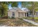 Inviting home with a cozy front porch, neutral exterior, and a well-maintained yard at 718 30Th N Ave, St Petersburg, FL 33704
