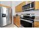 Modern kitchen featuring stainless steel appliances and granite countertops at 718 30Th N Ave, St Petersburg, FL 33704