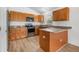 Modern kitchen with stainless steel appliances, granite countertops, and ample cabinet space at 718 30Th N Ave, St Petersburg, FL 33704