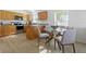 Cozy kitchen with wooden cabinets, stainless steel appliances, and dining area at 718 30Th N Ave, St Petersburg, FL 33704