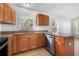 Lovely kitchen with granite countertops, wooden cabinets, and stainless steel appliances at 718 30Th N Ave, St Petersburg, FL 33704