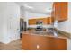 Open kitchen with stainless steel appliances, granite countertops and breakfast bar at 718 30Th N Ave, St Petersburg, FL 33704