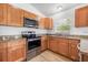 Well-equipped kitchen features stainless steel appliances and granite countertops, offering both style and functionality at 718 30Th N Ave, St Petersburg, FL 33704