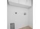 Functional laundry area with utility hookups and tile flooring at 718 30Th N Ave, St Petersburg, FL 33704