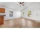 Bright living room features wood floors, ceiling fan, and natural light at 718 30Th N Ave, St Petersburg, FL 33704