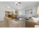 Comfortable living room with open floorplan flowing to kitchen with stainless appliances at 718 30Th N Ave, St Petersburg, FL 33704
