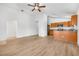 Open-concept living area features wood floors and adjoins the kitchen, creating a spacious and modern living space at 718 30Th N Ave, St Petersburg, FL 33704