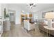 Cozy living room with natural light flowing to the kitchen with stainless appliances at 718 30Th N Ave, St Petersburg, FL 33704