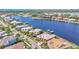 Aerial view of waterfront homes featuring private boat docks and access to bay at 729 Manns Harbor Drive, Apollo Beach, FL 33572