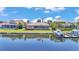 Waterfront property with screened lanai, private dock, and boat lift offering direct access to the open water at 729 Manns Harbor Drive, Apollo Beach, FL 33572
