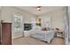 Cozy bedroom with a ceiling fan and a large window for plenty of natural light at 729 Manns Harbor Drive, Apollo Beach, FL 33572