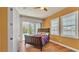 Charming bedroom boasting hardwood floors, water views, and direct access to the pool at 729 Manns Harbor Drive, Apollo Beach, FL 33572