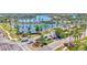 Beautiful community entrance with lush landscaping, a guardhouse, and a view of the lake beyond at 729 Manns Harbor Drive, Apollo Beach, FL 33572