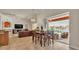 Bright dining area with high ceilings, a dining table with seating for six and views of the pool at 729 Manns Harbor Drive, Apollo Beach, FL 33572
