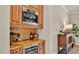 A kitchen wine and coffee bar with built-in Miele coffee system and wine fridge at 729 Manns Harbor Drive, Apollo Beach, FL 33572