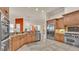 Spacious open kitchen featuring granite countertops, tile flooring, and stainless steel appliances at 729 Manns Harbor Drive, Apollo Beach, FL 33572