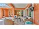 Well-appointed lanai with wicker furniture, patio decor, and view of other indoor spaces at 729 Manns Harbor Drive, Apollo Beach, FL 33572