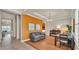 Bright living room featuring hardwood floors, modern furniture, and a large picture window at 729 Manns Harbor Drive, Apollo Beach, FL 33572